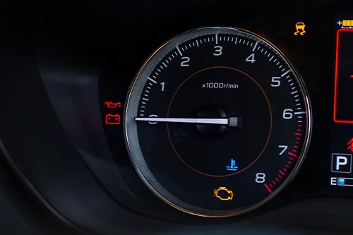 Close up picture of european car dashboard with check engine light | Motoring Specialists Inc