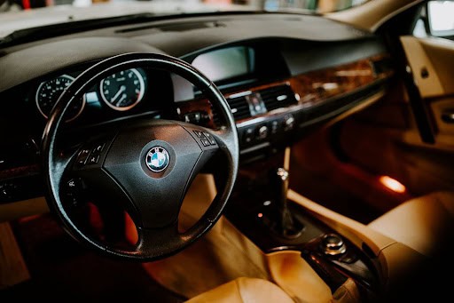 BMW Fluid Checks Guide | Motoring Specialists Vacaville | BMW Service Expertise. Image of the inside of a BMW steering wheel and dash that is in the shop for services.