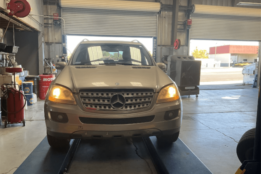 mercedes b service, auto repair in Vacaville, CA at Motoring Specialists. A Mercedes-Benz car inside a repair shop.