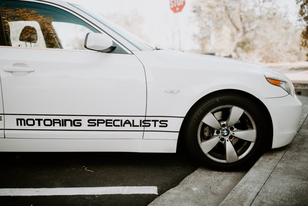 BMW Maintenance Checklist, european auto repair in Vacaville, CA at Motoring Specialists. A side view image of a white BMW vehicle.