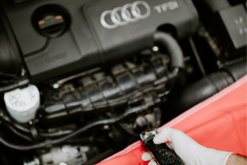 audi check engine light, european auto repair in Vacaville, CA at Motoring Specialists. Mechanic working on an Audi TFSi engine, ensuring peak performance and reliability.
