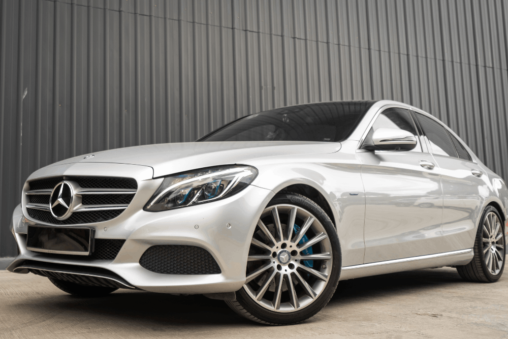 Airmatic suspension replacement in Vacaville, CA by Motoring Specialists. Image of a silver Mercedes sedan parked outside the shop, showcasing professional European auto service and precision maintenance for luxury vehicles.